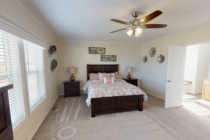 The K3066A Primary Bedroom. This Manufactured Mobile Home features 3 bedrooms and 2 baths.