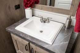 The FARMHOUSE 4 Guest Bathroom. This Manufactured Mobile Home features 4 bedrooms and 2 baths.
