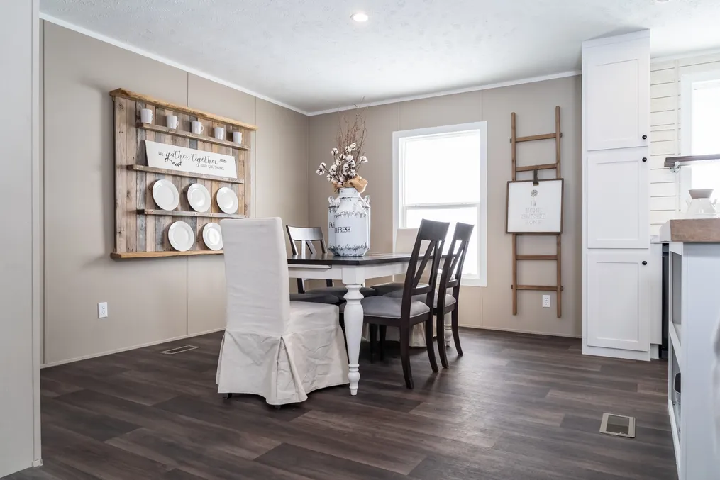 The THE RESERVE 60 Dining Area. This Manufactured Mobile Home features 3 bedrooms and 2 baths.