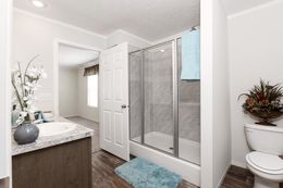 The CLASSIC 56G Primary Bathroom. This Manufactured Mobile Home features 3 bedrooms and 2 baths.