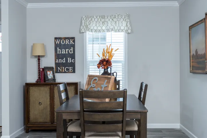 The THE FREEDOM BREEZE Dining Area. This Manufactured Mobile Home features 3 bedrooms and 2 baths.