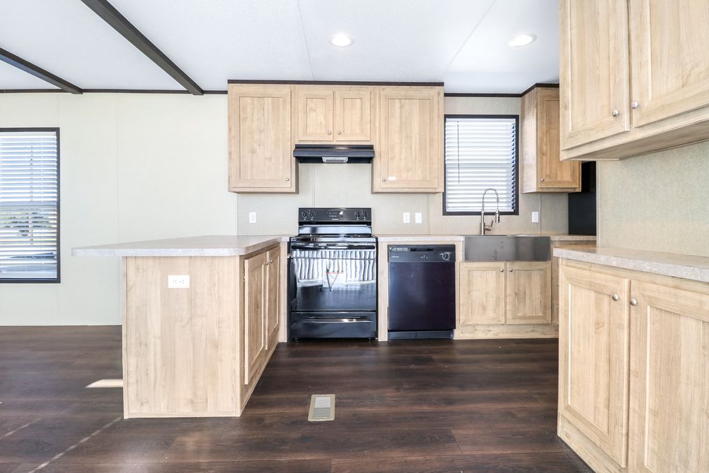 The ANNIVERSARY 16682A Kitchen. This Manufactured Mobile Home features 2 bedrooms and 2 baths.