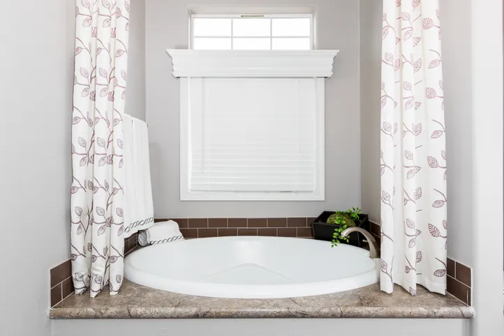 The ENCHANTMENT 3070A Guest Bathroom. This Manufactured Mobile Home features 3 bedrooms and 2 baths.