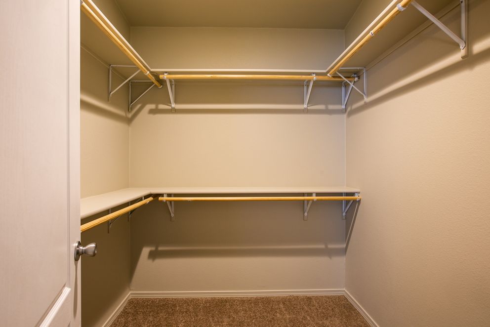 The THE WAVE Primary Bedroom. This Manufactured Mobile Home features 4 bedrooms and 2 baths.