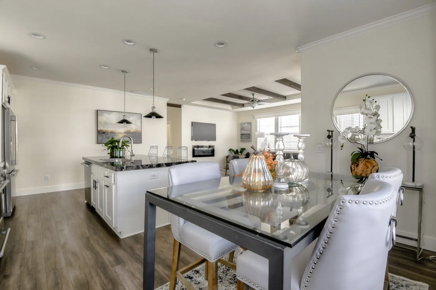 The CORONADO 2458F Dining Area. This Manufactured Mobile Home features 3 bedrooms and 3 baths.