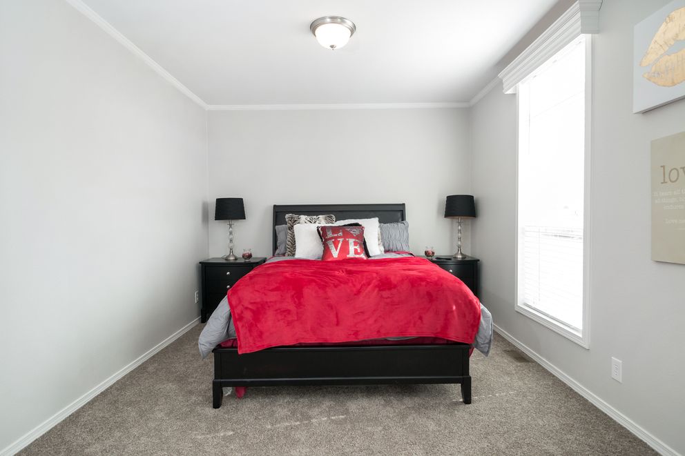 The ENCHANTMENT 3070A Primary Bedroom. This Manufactured Mobile Home features 3 bedrooms and 2 baths.