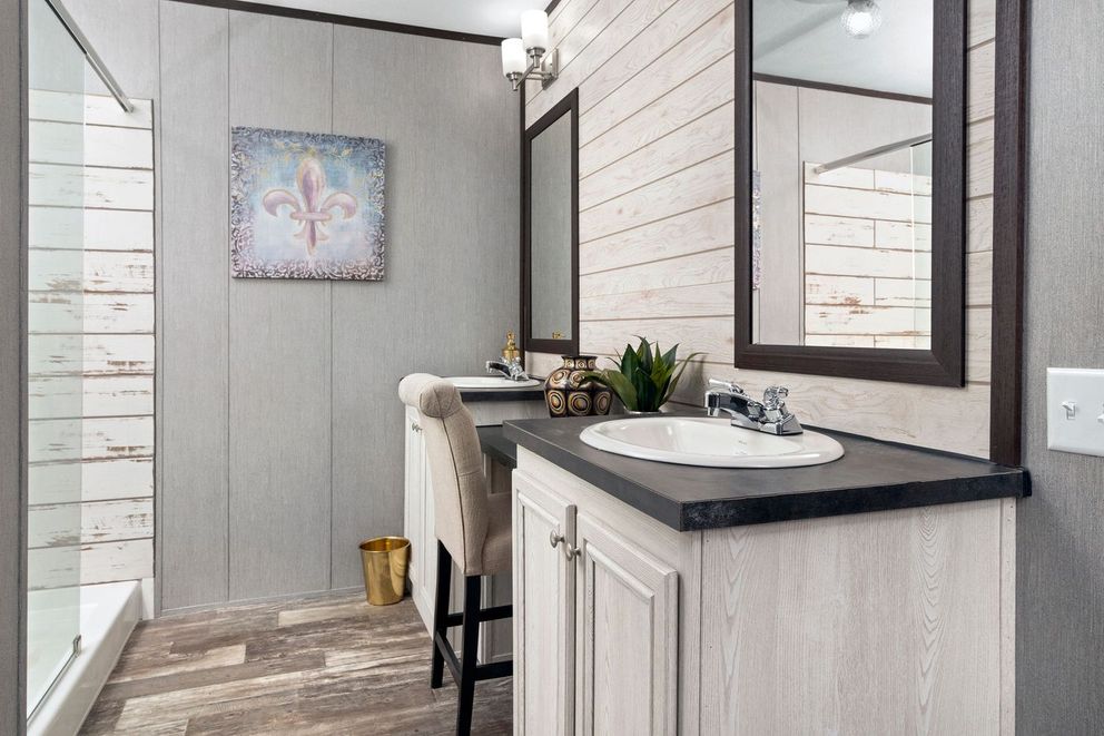 The THE SEASIDE Primary Bedroom. This Manufactured Mobile Home features 3 bedrooms and 2 baths.