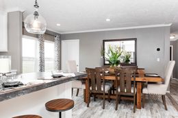 The THE CASCADE Dining Area. This Manufactured Mobile Home features 4 bedrooms and 2 baths.