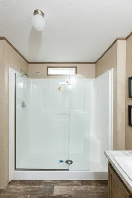 The THE RANCH HOUSE Primary Bathroom. This Manufactured Mobile Home features 3 bedrooms and 2 baths.