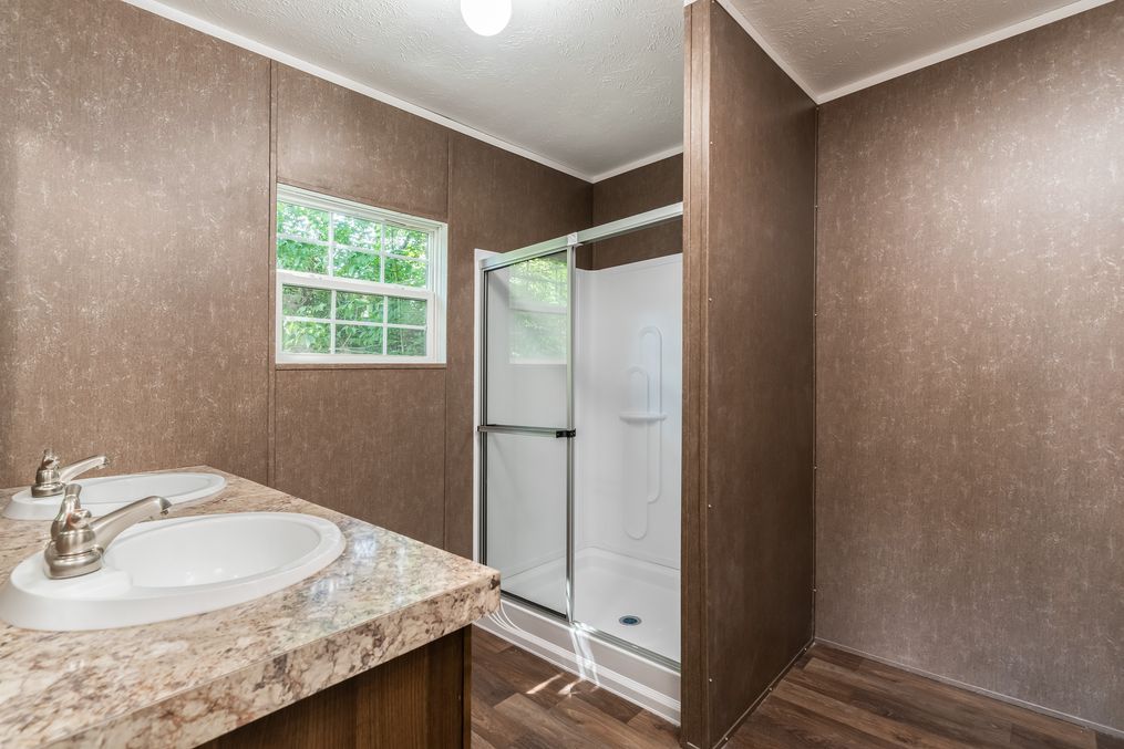 The TRADITION 3268B Guest Bathroom. This Manufactured Mobile Home features 5 bedrooms and 3 baths.