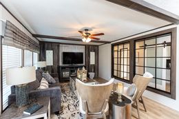 The THE HAMPTON BAY Living Room. This Manufactured Mobile Home features 3 bedrooms and 2 baths.