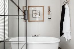 The PLATINUM ANNIVERSARY Primary Bathroom. This Manufactured Mobile Home features 3 bedrooms and 2 baths.