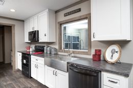 The FARMHOUSE 4 Kitchen. This Manufactured Mobile Home features 4 bedrooms and 2 baths.