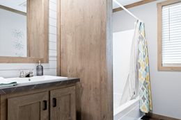 The FARMHOUSE 3 Guest Bathroom. This Manufactured Mobile Home features 3 bedrooms and 2 baths.