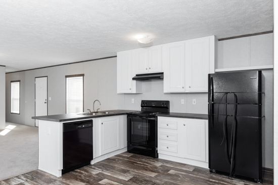 The BLAZER 76 4A Kitchen. This Manufactured Mobile Home features 4 bedrooms and 2 baths.