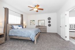 The 2095 HERITAGE Primary Bedroom. This Manufactured Mobile Home features 3 bedrooms and 2 baths.