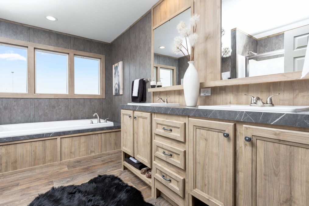 The BLUEBONNET BREEZE Primary Bathroom. This Manufactured Mobile Home features 3 bedrooms and 2 baths.