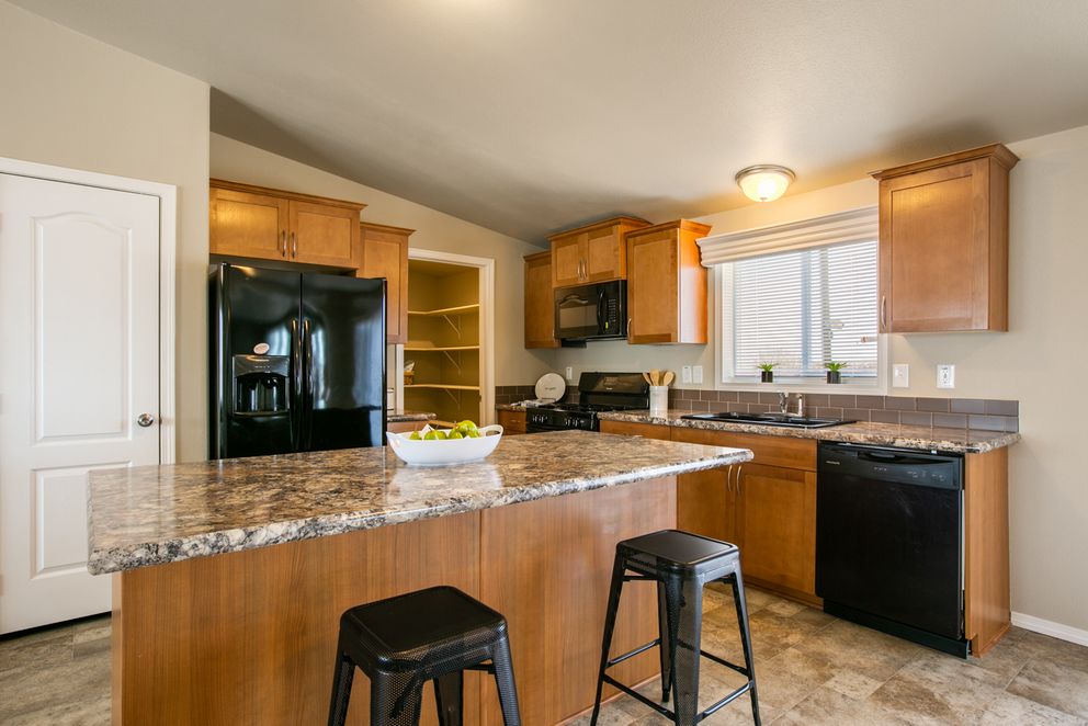 The THE WAVE Kitchen. This Manufactured Mobile Home features 4 bedrooms and 2 baths.