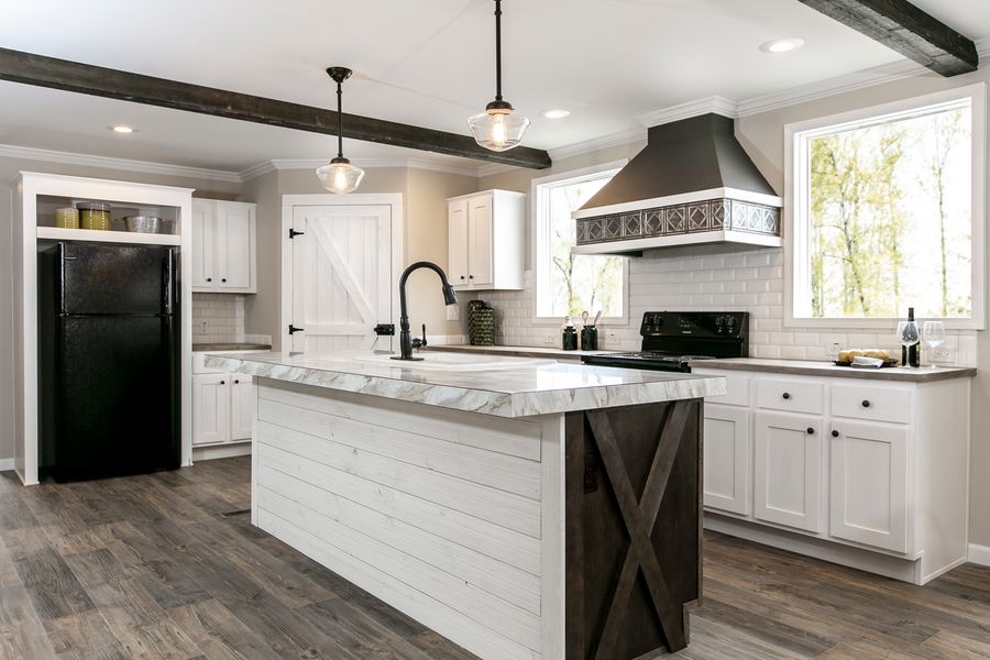 The FREEDOM FARM HOUSE  32X60 Kitchen. This Manufactured Mobile Home features 3 bedrooms and 2 baths.