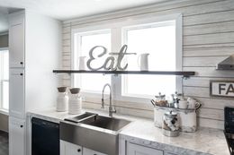 The THE RESERVE 60 Kitchen. This Manufactured Mobile Home features 3 bedrooms and 2 baths.