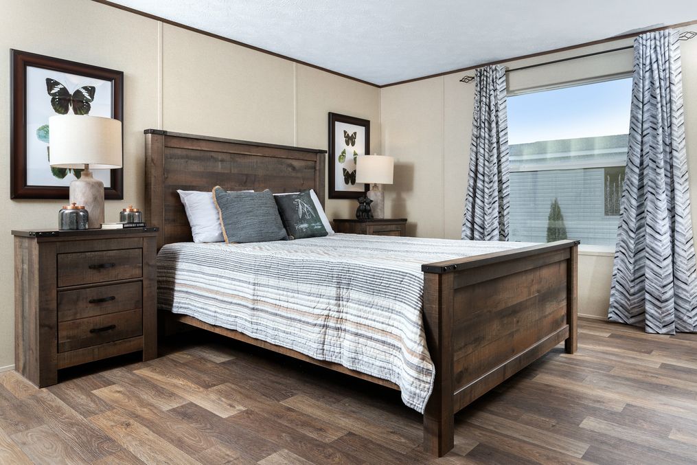 The VICTORY PLUS Primary Bedroom. This Manufactured Mobile Home features 3 bedrooms and 2 baths.