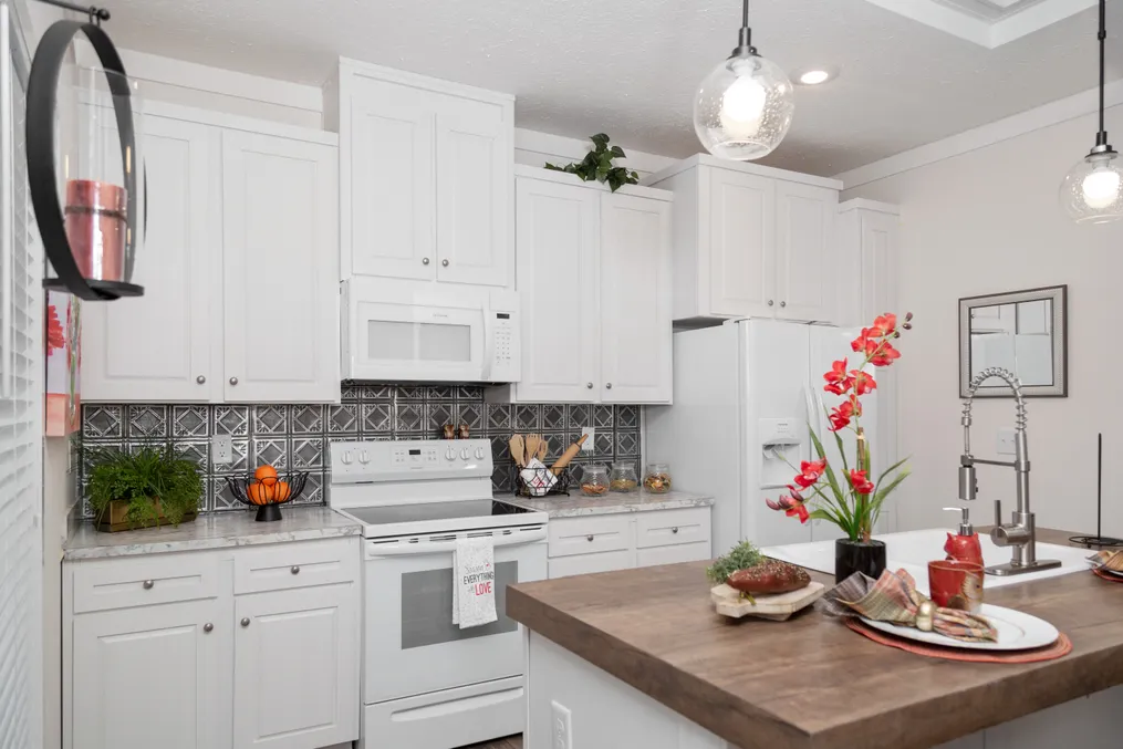 The 1439 CAROLINA "MAGNOLIA" Kitchen. This Manufactured Mobile Home features 3 bedrooms and 2 baths.