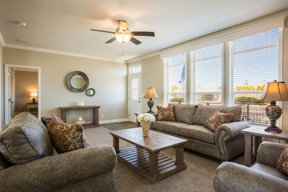 The EDGEWOOD Living Room. This Manufactured Mobile Home features 3 bedrooms and 2 baths.