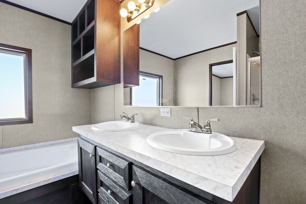 The THE ANNIVERSARY SPLASH Master Bathroom. This Manufactured Mobile Home features 3 bedrooms and 2 baths.