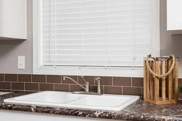 The ENCHANTMENT 3070A Kitchen. This Manufactured Mobile Home features 3 bedrooms and 2 baths.