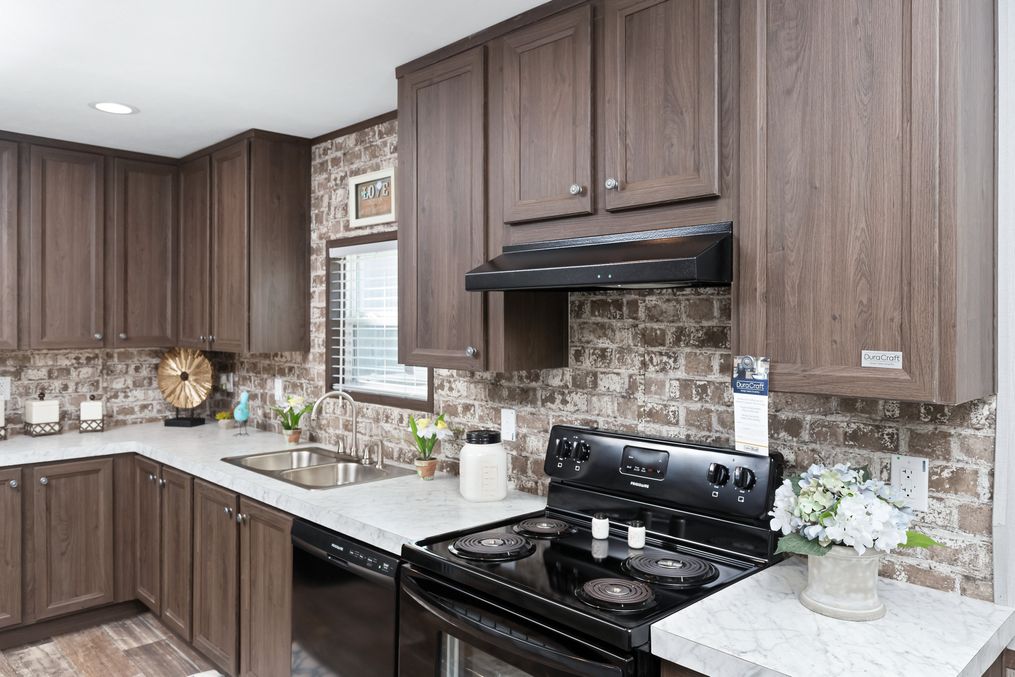 The CRAZY EIGHTS Kitchen. This Manufactured Mobile Home features 4 bedrooms and 2 baths.