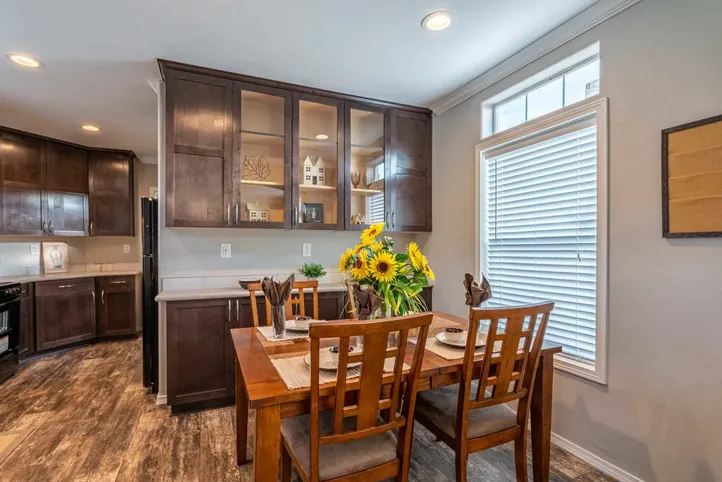The K1676H Dining Area. This Manufactured Mobile Home features 3 bedrooms and 2 baths.