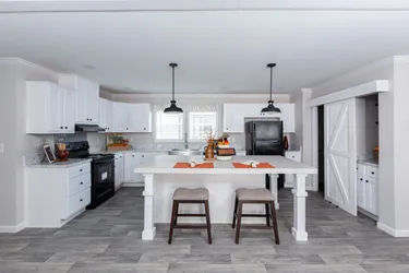 The THE FREEDOM BREEZE Kitchen. This Manufactured Mobile Home features 3 bedrooms and 2 baths.