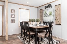 The FARM HOUSE BREEZE 56 Dining Area. This Manufactured Mobile Home features 3 bedrooms and 2 baths.