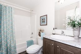 The CLASSIC 56G Guest Bathroom. This Manufactured Mobile Home features 3 bedrooms and 2 baths.