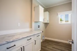 The EDGEWOOD Utility Room. This Manufactured Mobile Home features 3 bedrooms and 2 baths.