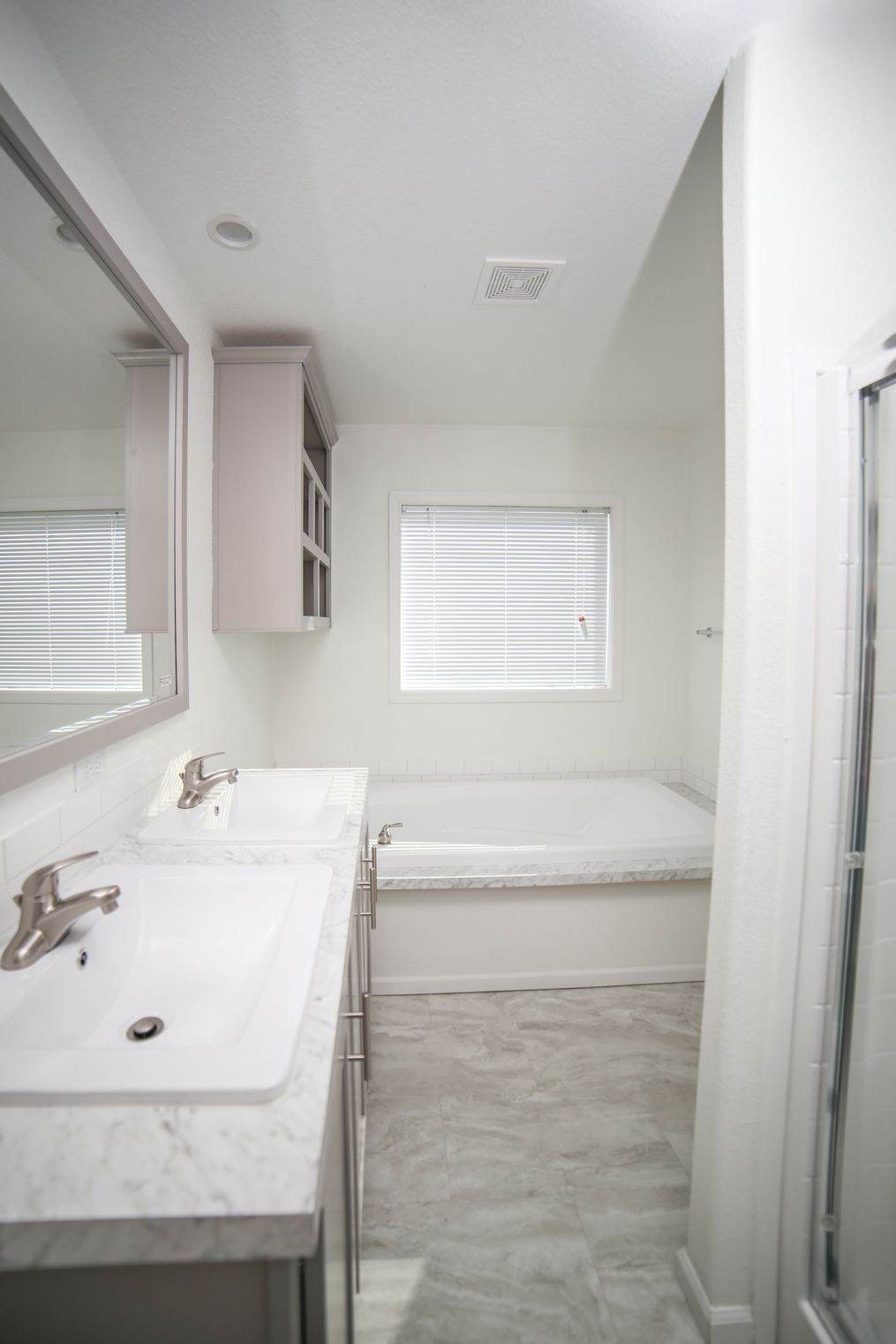 The CYAN Primary Bathroom. This Manufactured Mobile Home features 2 bedrooms and 2 baths.