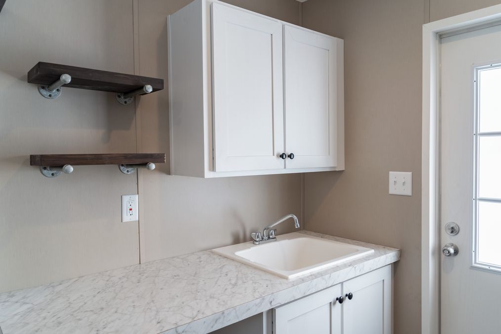 The THE RESERVE 60 Utility Room. This Manufactured Mobile Home features 3 bedrooms and 2 baths.
