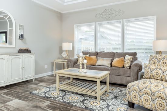 The 1714 HERITAGE Living Room. This Manufactured Mobile Home features 3 bedrooms and 2 baths.