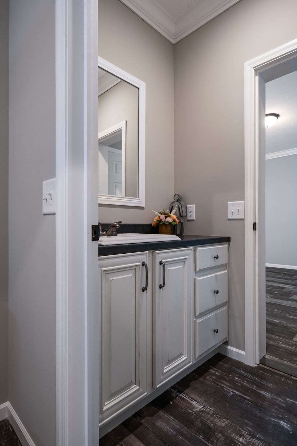 The THE TEAGAN Guest Bathroom. This Manufactured Mobile Home features 4 bedrooms and 3 baths.