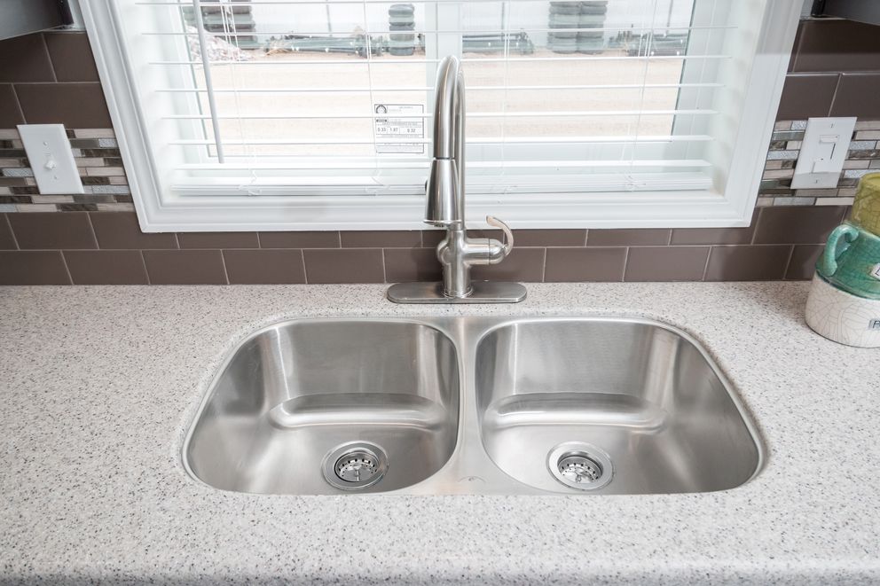 The ENCHANTMENT 3070A Kitchen. This Manufactured Mobile Home features 3 bedrooms and 2 baths.