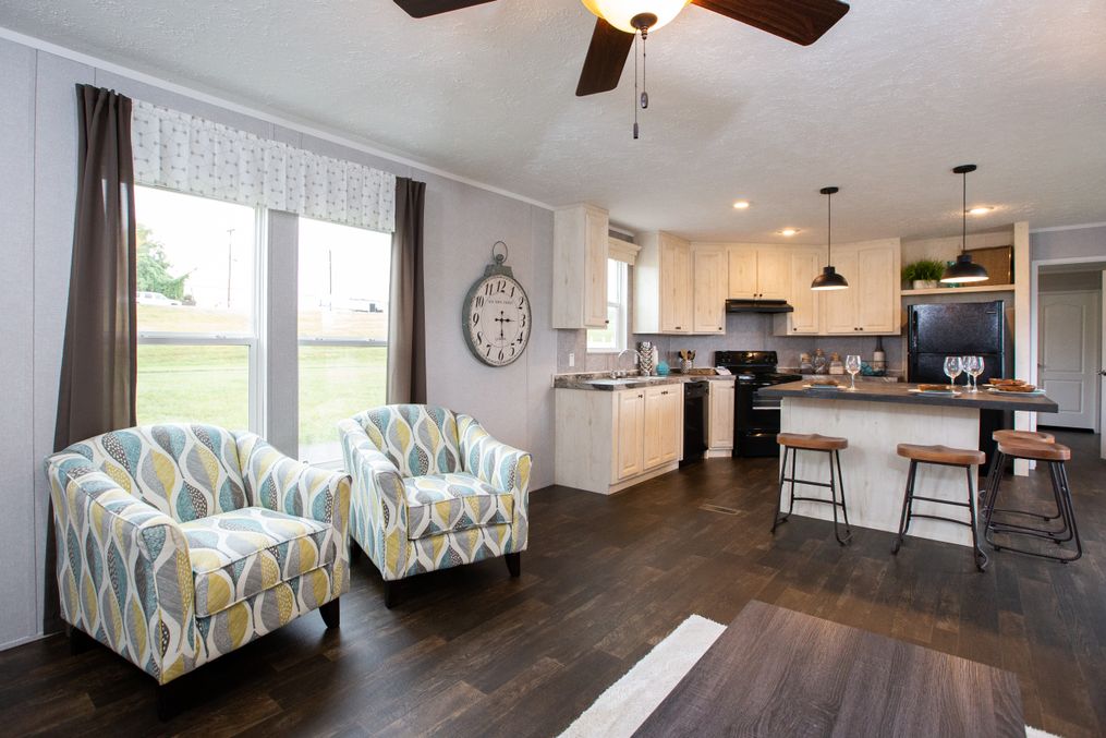 The FRONTIER Living Room. This Manufactured Mobile Home features 2 bedrooms and 2 baths.
