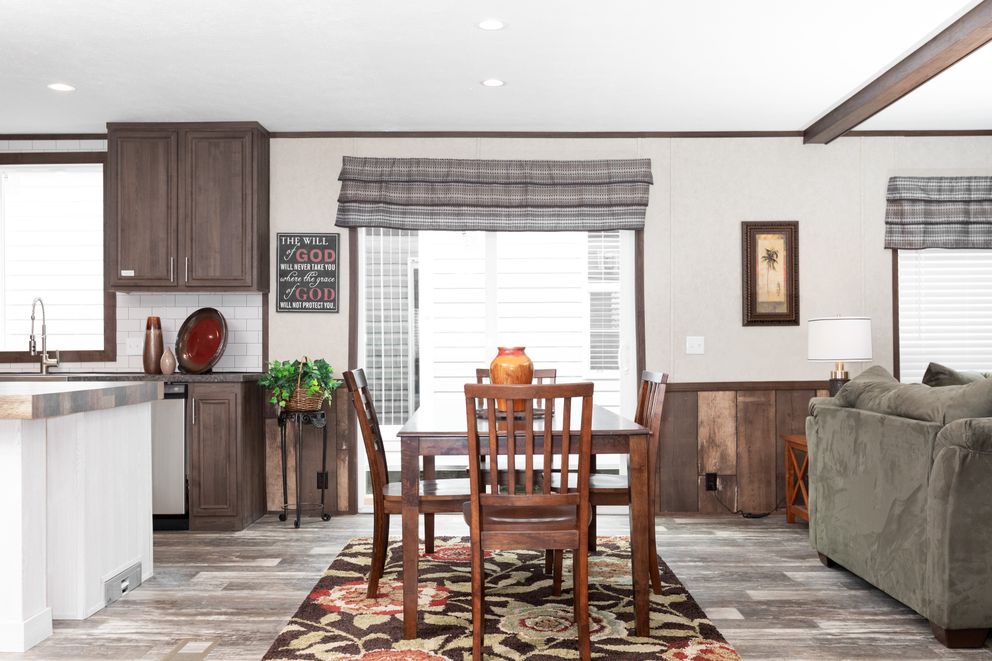 The THE RIVERWAY Dining Area. This Manufactured Mobile Home features 4 bedrooms and 2 baths.