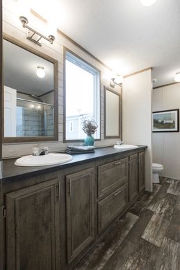 The THE SOUTHERN FARMHOUSE Master Bathroom. This Manufactured Mobile Home features 3 bedrooms and 2 baths.