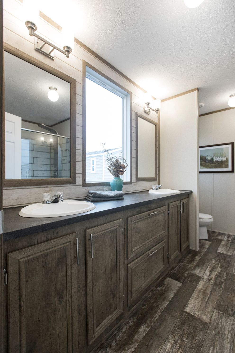 The THE SOUTHERN FARMHOUSE Primary Bathroom. This Manufactured Mobile Home features 3 bedrooms and 2 baths.