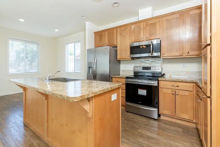 The FAIRPOINT 20523B Kitchen. This Manufactured Mobile Home features 3 bedrooms and 2 baths.