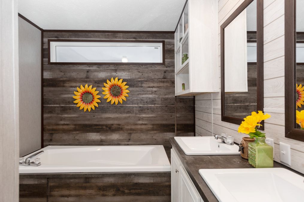 The THE GRANITE RIDGE Master Bathroom. This Manufactured Mobile Home features 3 bedrooms and 2 baths.