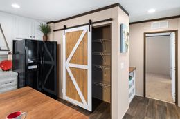 The BREEZE FARMHOUSE Kitchen. This Manufactured Mobile Home features 3 bedrooms and 2 baths.