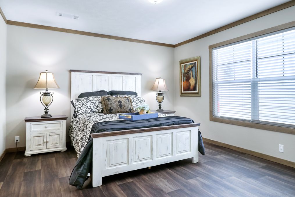The AMELIA Primary Bedroom. This Manufactured Mobile Home features 4 bedrooms and 2 baths.
