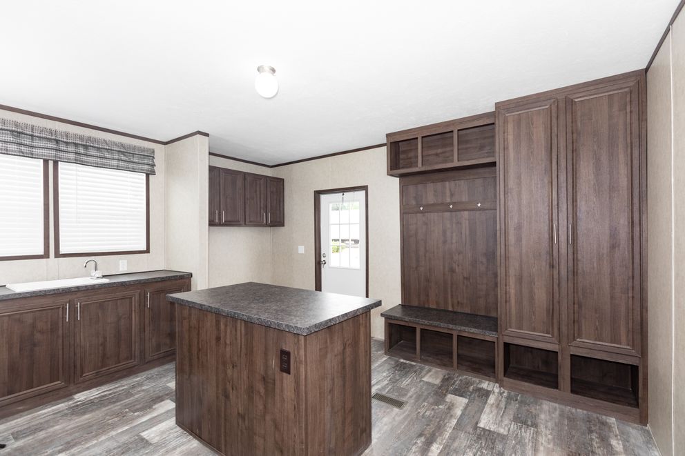 The THE RIVERWAY Utility Room. This Manufactured Mobile Home features 4 bedrooms and 2 baths.