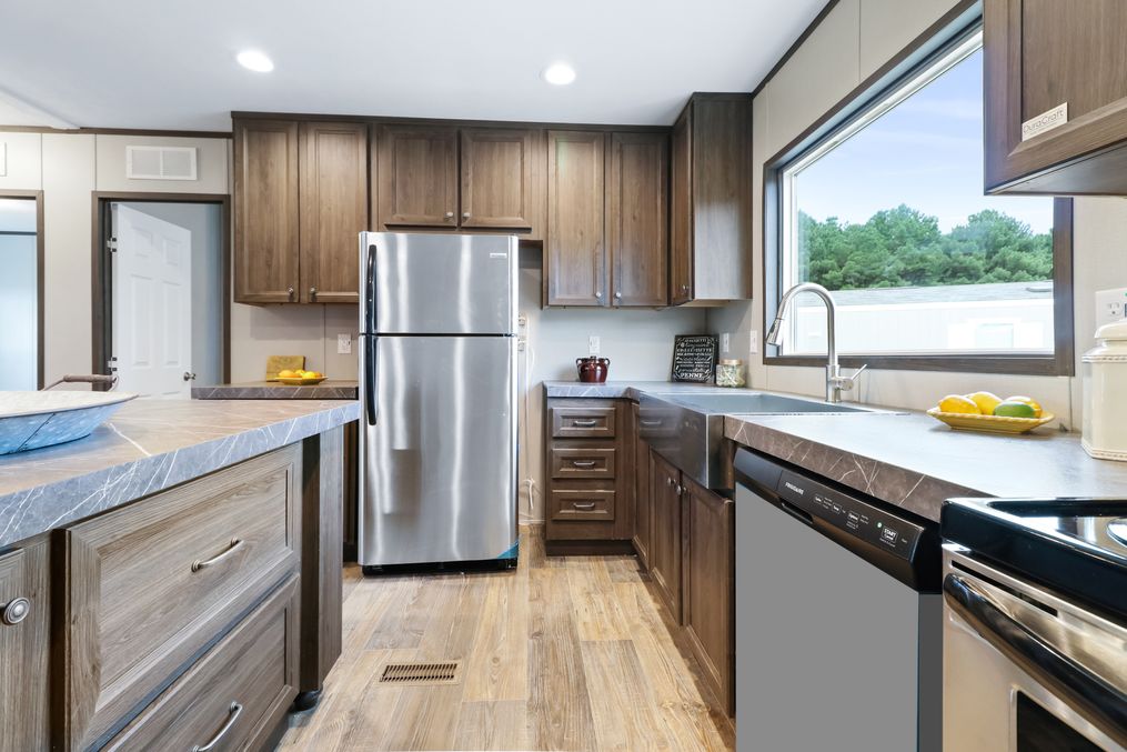 The THE REAL DEAL Kitchen. This Manufactured Mobile Home features 3 bedrooms and 2 baths.